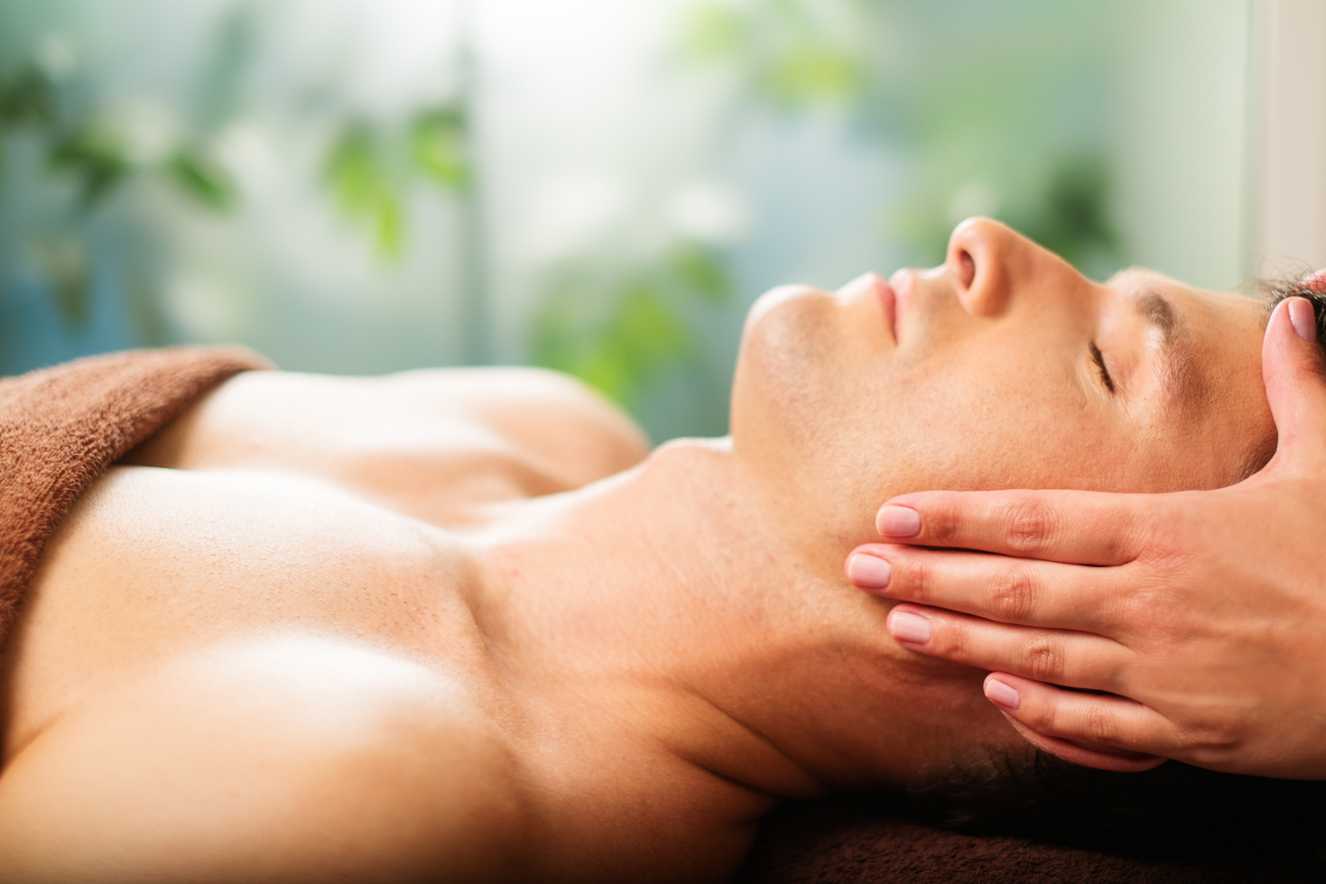  Man Having Face Massage in Spa Salon